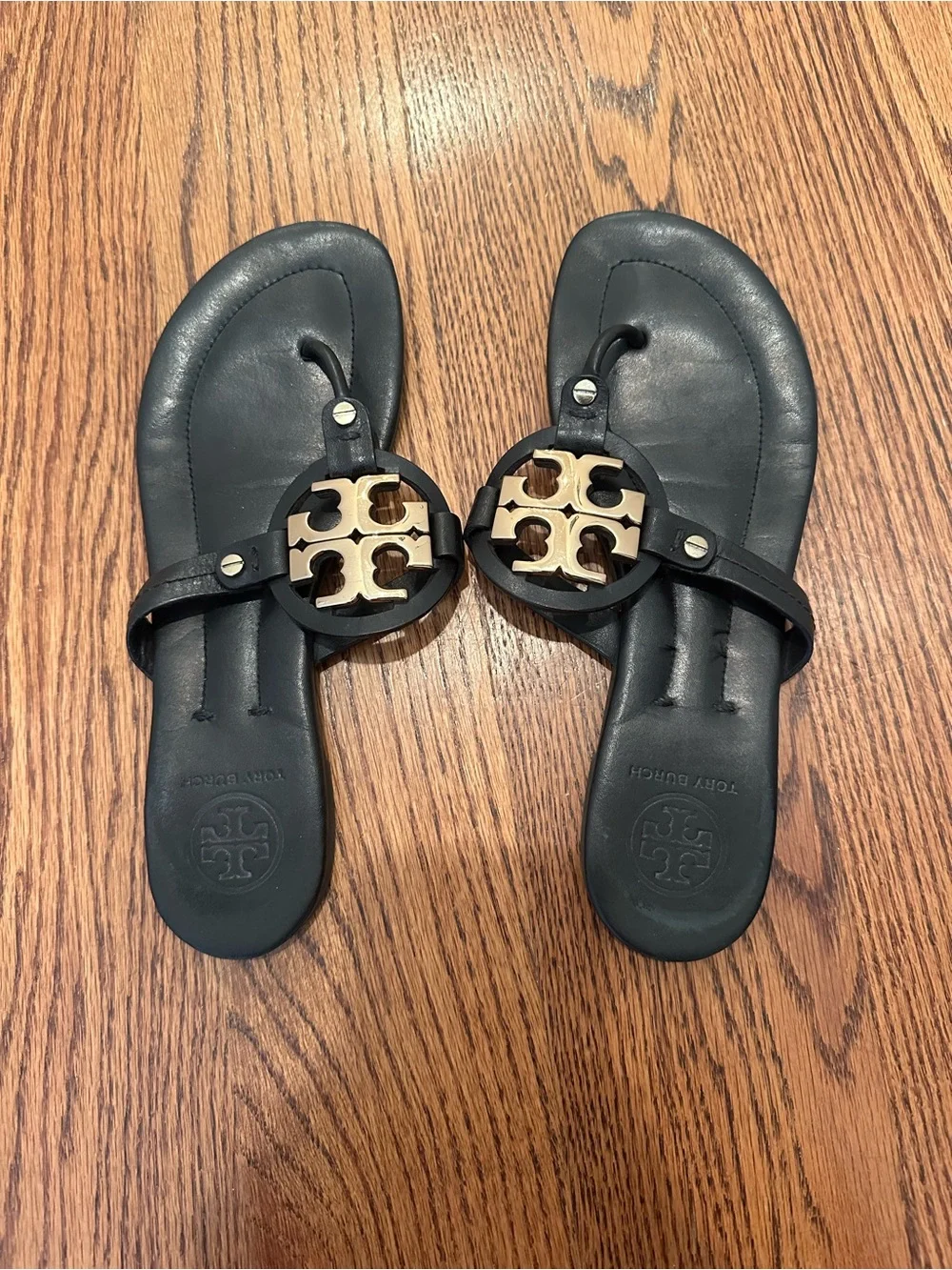 Tory Burch Black Leather Sandal with Gold Logo Medallion